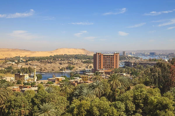 Egypt, Upper Egypt, Aswan, View of New and old Cataract Hotel with Khnum ruins in