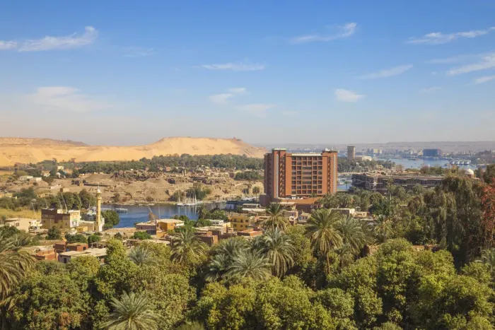 Framed Print : Egypt, Upper Egypt, Aswan, View of New and old Cataract Hotel with Khnum ruins in