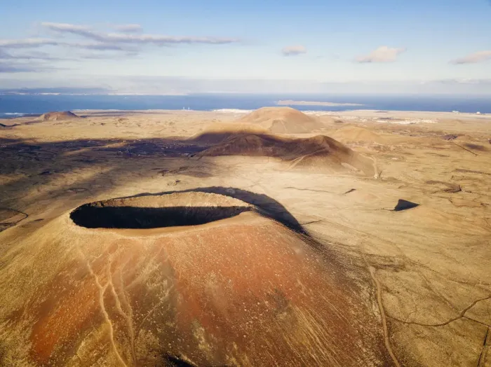 Framed Print : el Calderon Hondo, Volcano in Fuerteventura, ocean in background