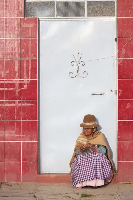 Framed Print : Elder woman sitted in front of a door in Copacabana, Lake Titicaca, La Paz, Bolivia Framed Print : Elder woman sitted in front of a door in Copacabana, Lake Titicaca, La Paz, Bolivia