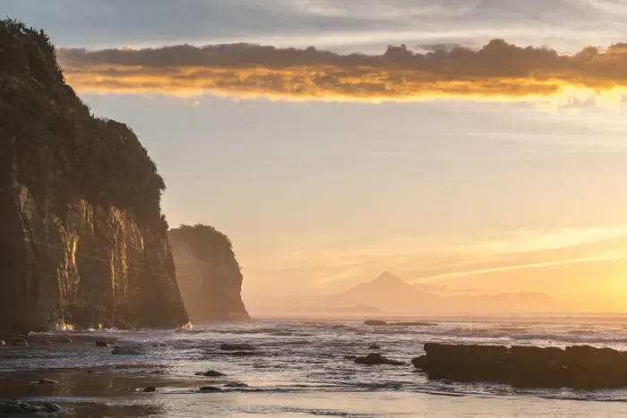 Framed Print : Elephant rock and Mount Taranaki silhouette in the background, at sunset. Tongaporutu Framed Print : Elephant rock and Mount Taranaki silhouette in the background, at sunset. Tongaporutu