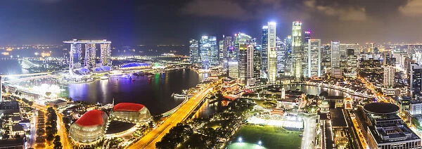 Elevated view of business district and Marina bay Sands at night, Singapore