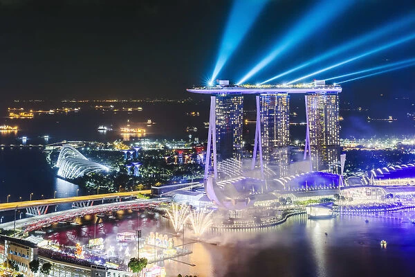 Elevated view of business district and Marina bay Sands at night, Singapore