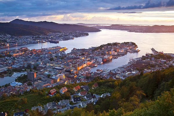 Elevated view over central Bergen illuminated at sunset, Bergen, Hordaland, Norway