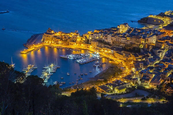 Elevated view of the fishing village Castellammare del Golfo at dusk, Trapani province