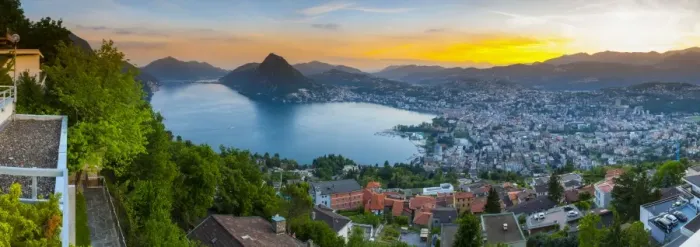 Framed Print : Elevated view over Lugano illuminated at sunset, Lake Lugano, Ticino, Switzerland