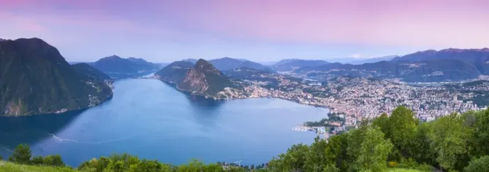 Framed Print : Elevated view over Lugano from Monte Bre illuminated at sunrise, Lugano, Lake Lugano