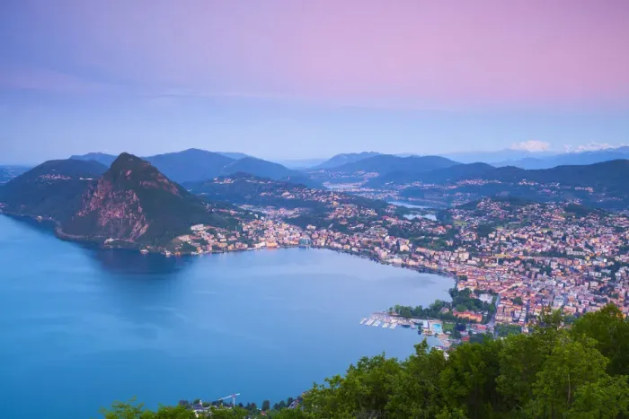 Framed Print : Elevated view over Lugano from Monte Bre illuminated at sunrise, Lugano, Lake Lugano
