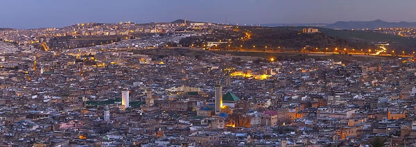 Elevated view across the Old Medina of Fes illuminated at Dusk, Fes, Morocco