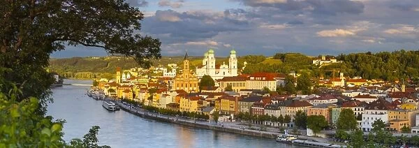 Elevated view towards the picturesque city of Passau illuminated at sunset, Passau