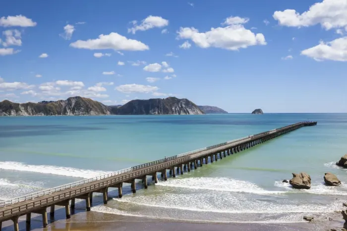 Framed Print : Elevated view over the picturesque Tologa Bay wharf, Tologa Bay, East Cape, North Island
