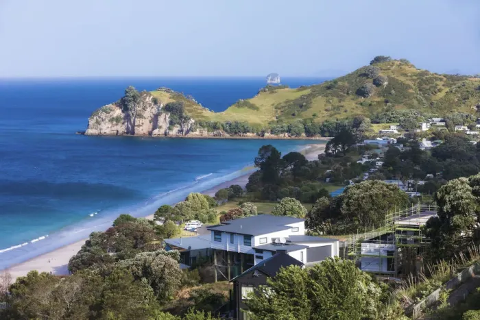Framed Print : Elevated view of the village and the Tasman sea in the background Framed Print : Elevated view of the village and the Tasman sea in the background