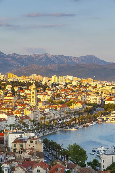Elevevated view over the picturesque harbour city of Split illuminated at sunset, Split