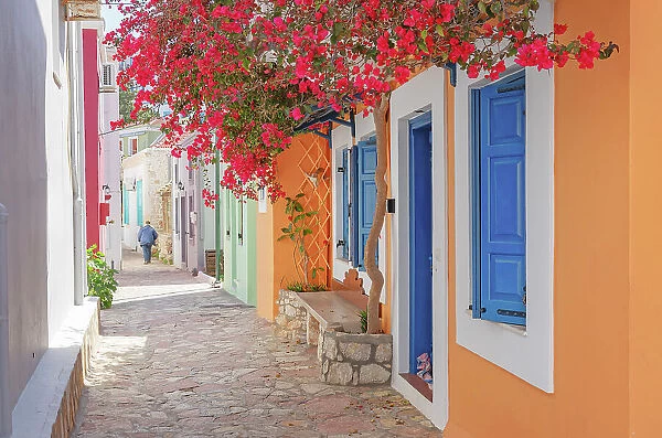 Emporio town street filled with Halki traditional houses, Halki Island, Dodecanese Islands, Greece