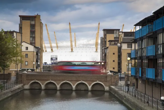 Framed Print : Endland, London, Canary Wharf, Bus going over bridge with O2 Arena in background