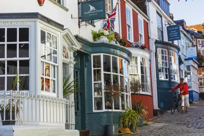 Framed Print : England, Hampshire, The New Forest, Lymington, Colourful Shop Fronts on Quay Hill Framed Print : England, Hampshire, The New Forest, Lymington, Colourful Shop Fronts on Quay Hill