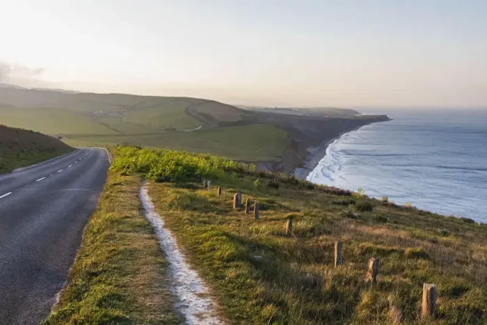 Framed Print : England, Isle of Wight, Coastal View of Road and Hiking Path with Brightstone Bay in the Distance Framed Print : England, Isle of Wight, Coastal View of Road and Hiking Path with Brightstone Bay in the Distance