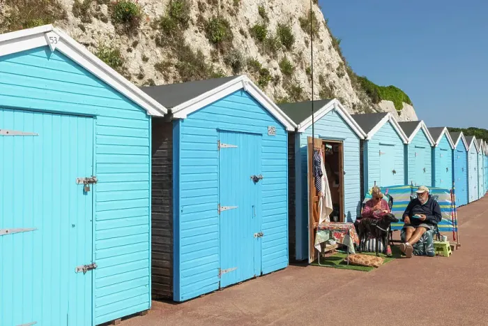 Framed Print : England, Kent, Broadstairs, Stone Bay, Row of Colourful Beach Huts, Elderly Hut Owners Eating Breakfast