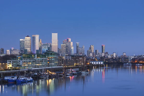 England, London, Docklands, River Thames and Canary Wharf Skyline at dusk