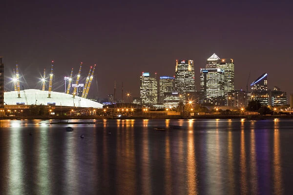 England, London, Newham, O2 Arena and Canary Wharf buildings reflecting in Royal Victoria