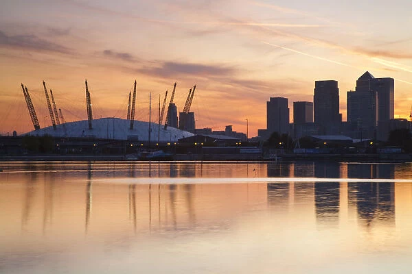 England, London, Newham, O2 Arena and Canary Wharf buildings reflecting in Royal Victoria