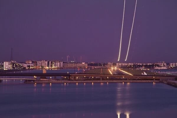 England, London, Newham, Royal Victoria Docks, London city airport, Plane taking off at night