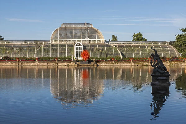 England, London, Richmond, Kew Gardens, The Palm House Reflected in Lake