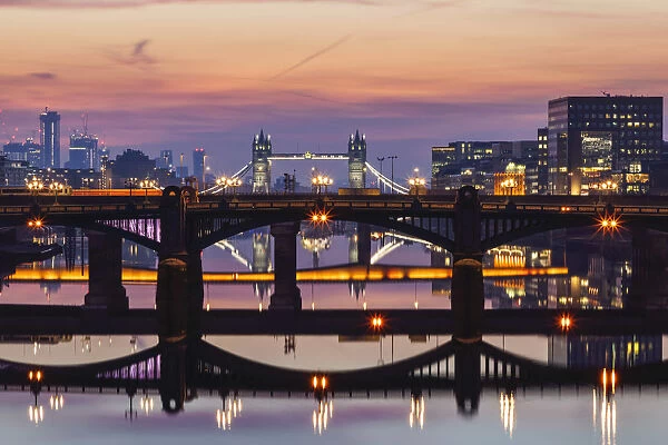 England, London, Southwark, London Bridge City, Reflections of Thames Bridges at Dawn