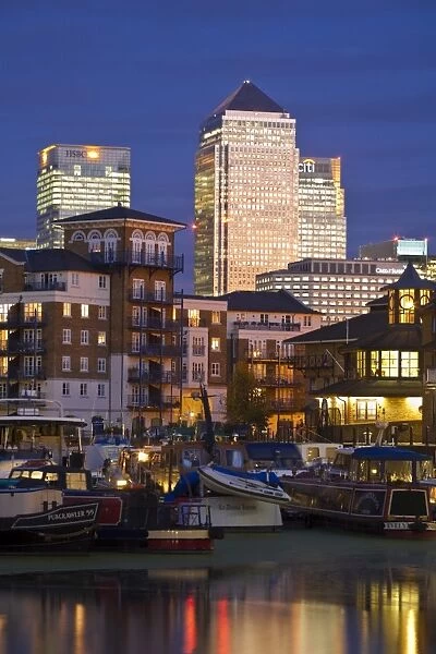 England, London, Tower Hamlets, Limehouse Basin with Canary Wharf buildings in background