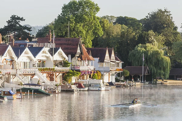 England, Oxfordshire, Henley-on-Thames, Boathouses and Rowers on River Thames