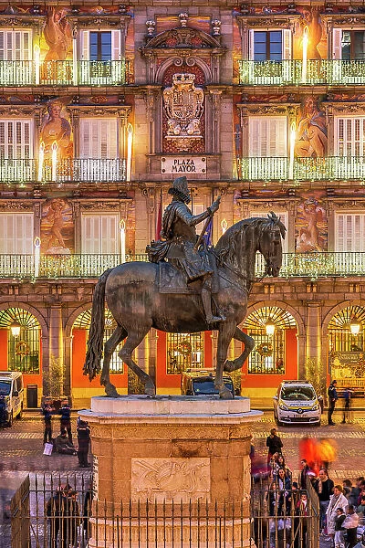 Equestrian statue of Philip III King of Spain with christmas lights behind, Plaza Mayor, Madrid, Spain