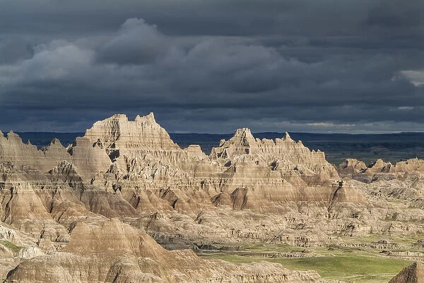 The eroded rocky formations of the Badlands region in South Dakota under a threatening