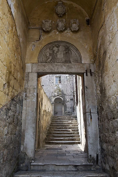 Europe, Croatia, Dalmatia, Dubrovnik, a gate and stone stairway in the historic centre