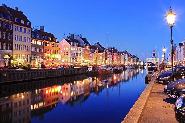 Europe, Denmark, Zealand, Copenhagen, a night time shot of colourful houses in Nyhavn