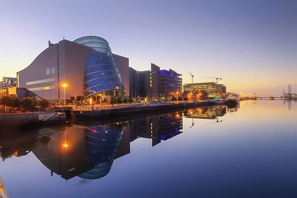 Europe, Dublin, Ireland, buildings reflecting on the Liffey river by night
