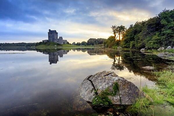 Europe, Dublin, Ireland, Dunguaire castle in Kinvara village at sunrise reflecting