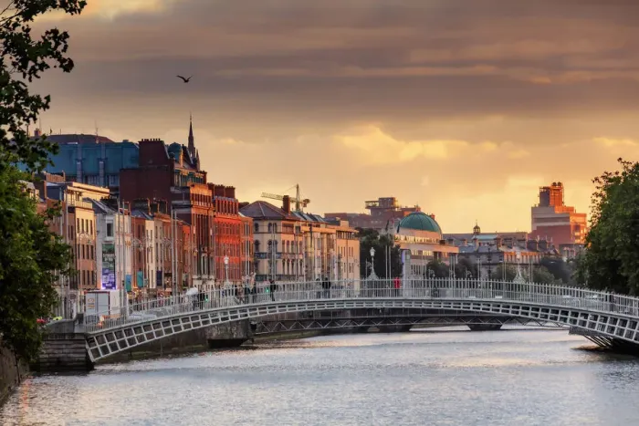 Framed Print : Europe, Dublin, Ireland, people crossing Halfpenny bridge on the Liffey river at sunset Framed Print : Europe, Dublin, Ireland, people crossing Halfpenny bridge on the Liffey river at sunset