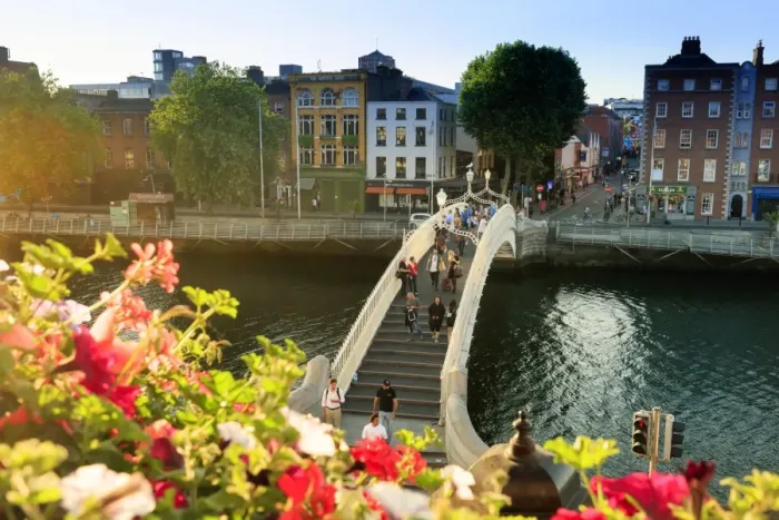 Framed Print : Europe, Dublin, Ireland, tourists crossing the famous Halfpenny bridge on the Liffey Framed Print : Europe, Dublin, Ireland, tourists crossing the famous Halfpenny bridge on the Liffey