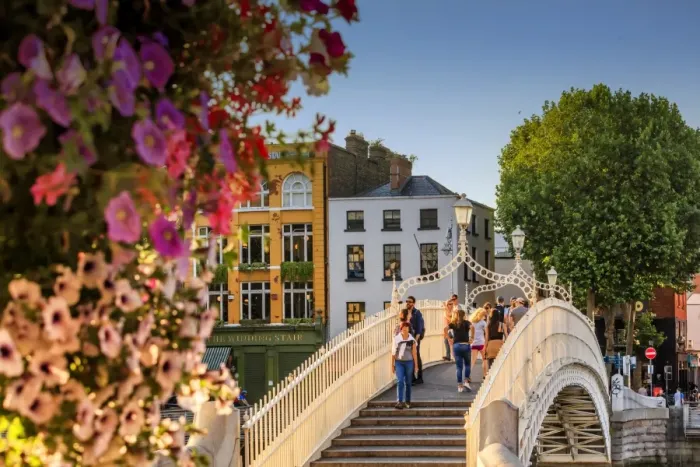 Framed Print : Europe, Dublin, Ireland, tourists crossing the famous Halfpenny bridge on the Liffey