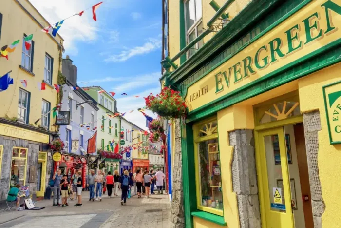 Framed Print : Europe, Dublin, Ireland, Tourists walking along Galway town streets and sitting Framed Print : Europe, Dublin, Ireland, Tourists walking along Galway town streets and sitting