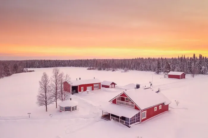 Framed Print : Europe, Finland, aerial view of a group of red buidlings on a frozen lake with the sun rising near Rovaniemi Framed Print : Europe, Finland, aerial view of a group of red buidlings on a frozen lake with the sun rising near Rovaniemi
