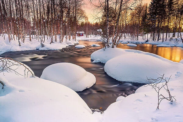 Europe, Finland, river near Ruka at sunset in winter