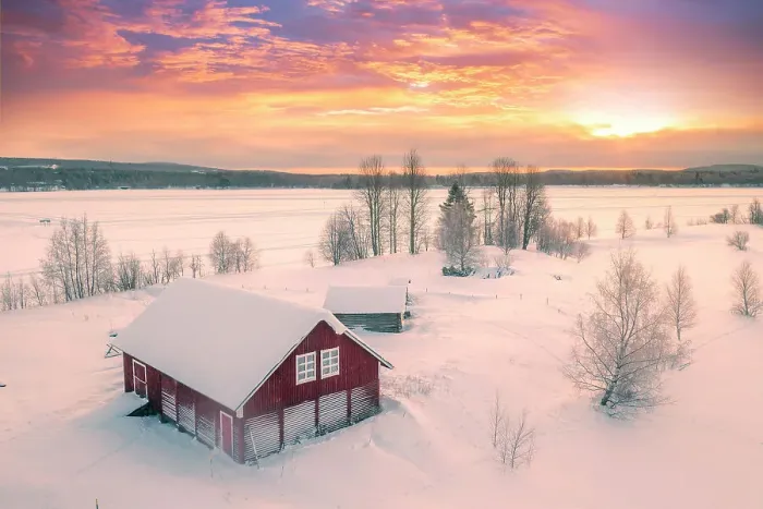 Framed Print : Europe, Finland, Rovaniemi, aerial view of a frozen lake near Rovaniemi with traditional red buildings with the sun rising on a winter morning Framed Print : Europe, Finland, Rovaniemi, aerial view of a frozen lake near Rovaniemi with traditional red buildings with the sun rising on a winter morning