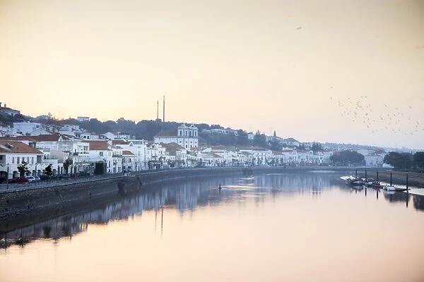 Europe, Iberia, Portugal, The Alentejo, Alcacer do Sal town reflected in the waters