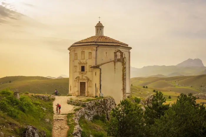 Framed Print : europe, Italy, the Abruzzi. On mountain bike in front of the church Santa Maria della Framed Print : europe, Italy, the Abruzzi. On mountain bike in front of the church Santa Maria della