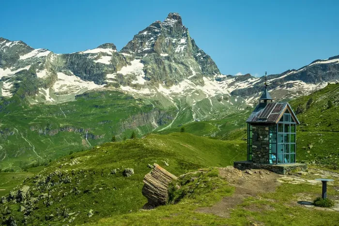 Framed Print : Europe, Italy, Aosta Valley. The iconic Matterhorn seen from a hiking path near to Breuil-Cervinia. In the foreground the little chapel Santa Anna
