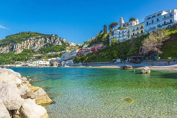 Europe, Italy, Campania. The cristal clear water of Capri on the spiaggia of Cala Grande