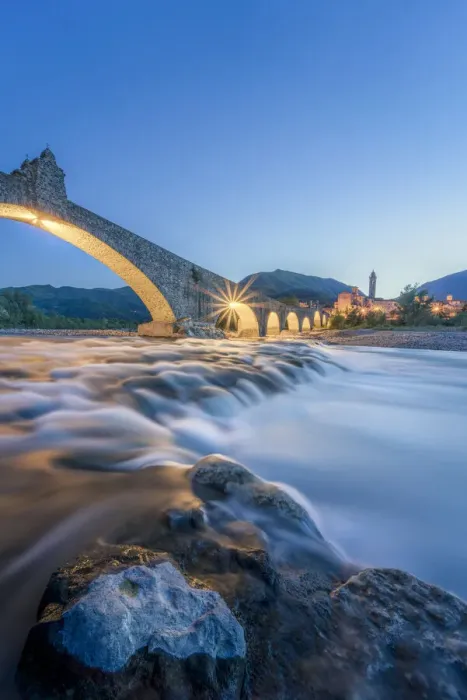 Framed Print : Europe, Italy, Emilia Romagna: Bobbio, falls on the Trebbia river and the medieval town at twilight Framed Print : Europe, Italy, Emilia Romagna: Bobbio, falls on the Trebbia river and the medieval town at twilight