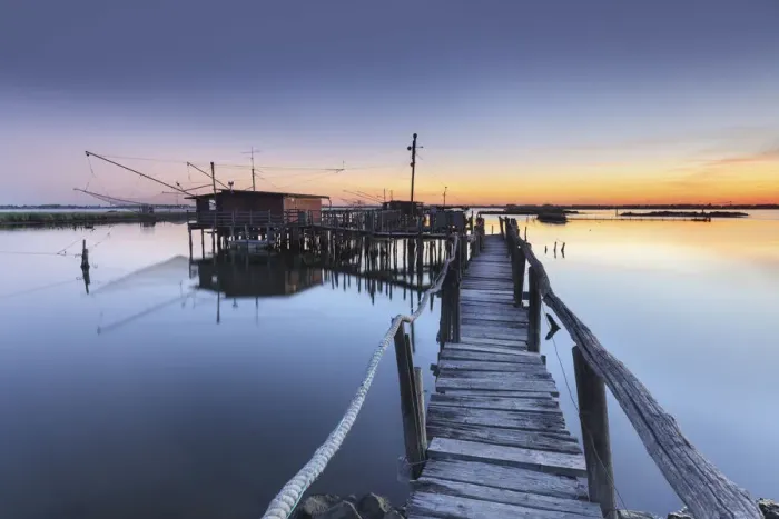 Framed Print : Europe, Italy, Emilia Romagna, Ferrara. Fishing huts on stilts in the valleys of Comacchio Framed Print : Europe, Italy, Emilia Romagna, Ferrara. Fishing huts on stilts in the valleys of Comacchio