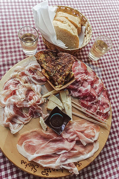 europe, Italy, Friuli Venezia Giulia. A plate with cold cuts at a typical Osmiza - a temporary tavern